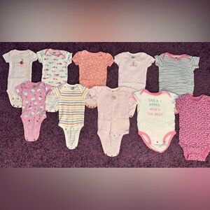 Baby girl onesies in various sizes